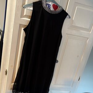 Elegant Black Sleeveless Dress with Embellished Collar
